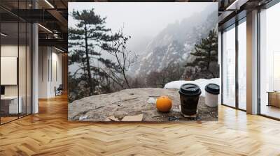  an orange and two paper cups with black lids on top of it Wall mural