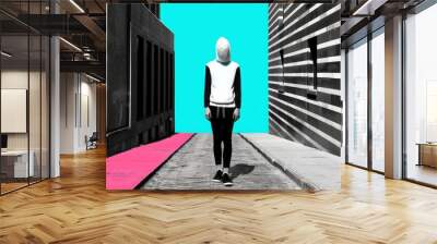 A person in biodegradable garments walks through an empty urban alleyway, highlighting the negative space between sustainable fashion and stark industrial architecture Wall mural