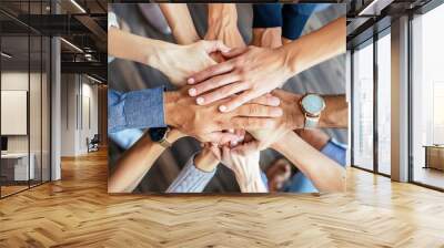 The top-view of diverse people nationalities fold their hands together on each other, symbolizing their unity and support. A team of people who are set up for productive work and a positive result. Wall mural