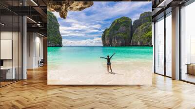 Young Asian lady tourist on the  the beach, Ma Ya bay, Phi Phi island  krabi province Thailand. Wall mural