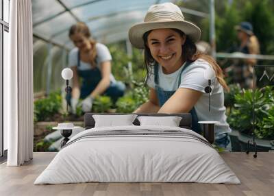 Success, agriculture and teamwork with a tablet in a greenhouse for plants or sustainability. Happy people with technology and fist bump to celebrate farm growth, agro business or quality control app Wall mural