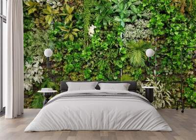 Vertical garden with various species of artificial trees.natural background Wall mural