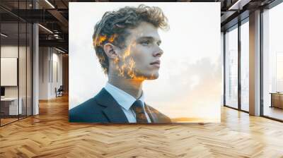 A man in a suit and tie is standing in front of a cloudy sky Wall mural