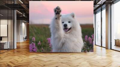 a white dog standing in a field of flowers Wall mural