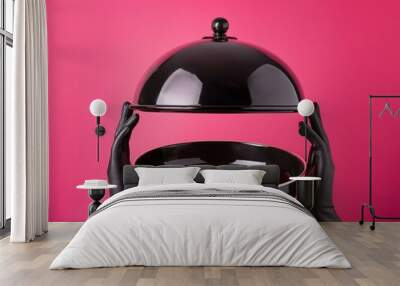 Black Dish with floating lid holding black mannequin hands isolated on hot pink, opened restaurant cloche Wall mural