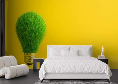 green light bulb made of grass isolated on yellow background Wall mural