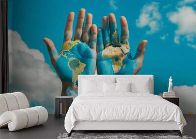 A pair of hands one painted with the earth and the other with the sky Wall mural