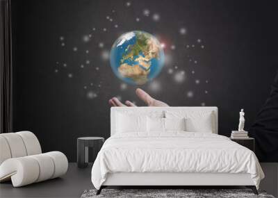 business hand holding globe earth concept business social. Elements of this image furnished by NASA Wall mural