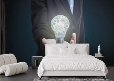 Business hand holding light bulb. concept of new ideas with innovation and creativity. Wall mural