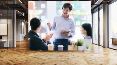 Business people discussing, talking and smiling during conference in modern office. Wall mural