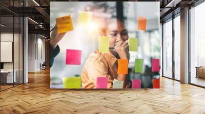 Young businesswoman creative team using sticky notes in glass wall to writing strategy business plan to development grow to success. Wall mural