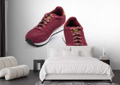 a pair of new burgundy, cherry sneakers or athletic shoes isolated on a white background. Wall mural