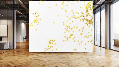 Gold confetti and stars and sparkles on a light background. Top view, flat lay. Copy text. Bright and festive background. For Christmas, New Year, Mother's Day. Wall mural