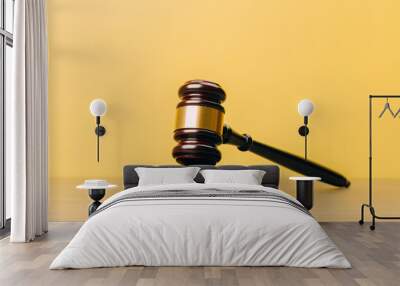 Judge Gavel on a wooden table and yellow-orange background. Wall mural