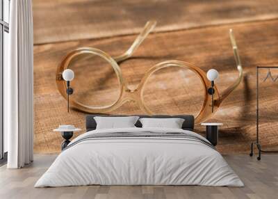 old glasses on wooden surface Wall mural