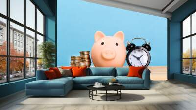 pink piggy bank on a blue background, space for text. Finance, saving money. Business to Success and Retirement Savings Wall mural