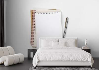 school notebook on a white background, spiral notepad on a table. Wall mural