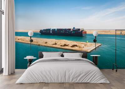 Container cargo ship sailing on Suez Canal. Wall mural