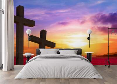 Crucifixion of Jesus Christ.  Silhouette of three crosses against sunset sky. Wall mural