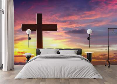 Silhouette of crucifix cross at sunset sky. Wall mural