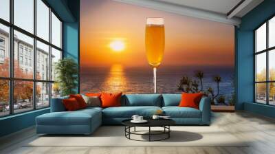  A tall, elegant flute of mimosa with a bright orange hue, set against a minimalistic backgro Wall mural