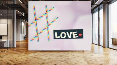 Fondo con la palabra Love destacada sobre negro con colores bonitos  Wall mural