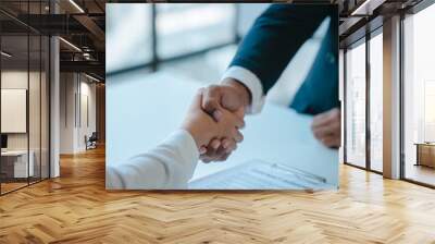 Shaking hands after sign a contract, realtor suggestion a new house model assisting client to sign contract agreement with insurance to happy living building, concerning mortgage loan offer Wall mural