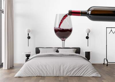 Red wine pouring in glass on white background Wall mural