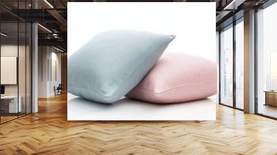 A pair of decorative throw cushions in pastel colors, isolated on a white background Wall mural