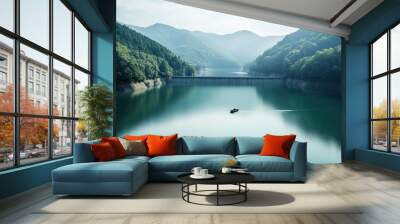 A serene lake formed by a hydroelectric dam, with a small boat gliding across the still water. Wall mural