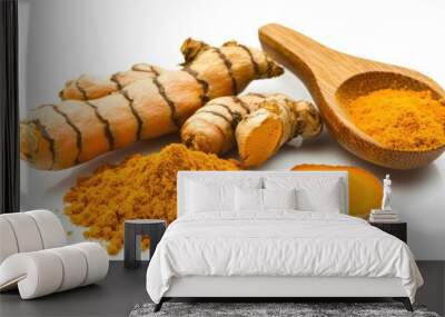 A wooden spoon scooping turmeric powder with a fresh root next to it, isolated on white Wall mural