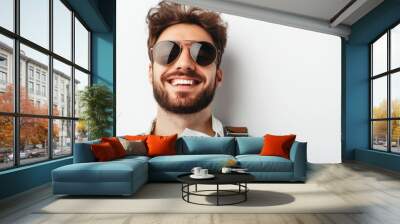 Adorable pilot with aviator sunglasses and a flight plan, smiling confidently, isolated on a white background. Wall mural