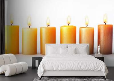 Elegant set of softly glowing pillar candles isolated on a blank white background Wall mural