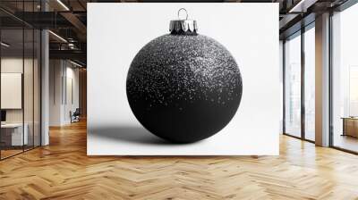 Matte black Christmas ball with silver glitter accents, creating a modern holiday aesthetic on white Wall mural