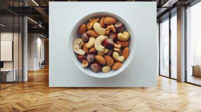 A bowl of mixed nuts including cashews, almonds, and walnuts Wall mural