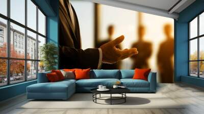 A man in a suit is giving a presentation to a group of people Wall mural