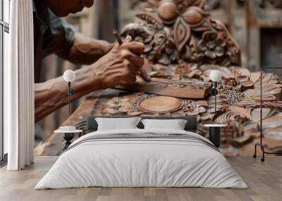 A man is carving a wooden design with a pencil Wall mural