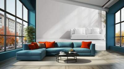 A white living room with a couch and a potted plant Wall mural