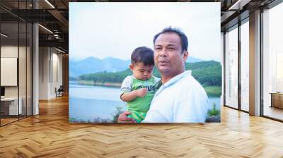 Father holding his son Wall mural