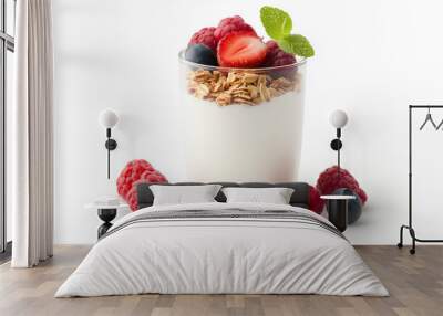 Creamy yogurt topped with fresh raspberries, blueberries, and slice of strawberry, garnished with mint leaves, creating delicious and healthy dessert. Wall mural