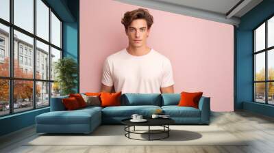 Mockup tshirt for design. Portrait of confident young man in short blonde hair wear blank T-Shirt. Wall mural