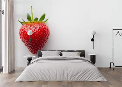 single ripe strawberry with green leaves on white background. vibrant red color and fresh appearance make it look delicious and appealing. Wall mural