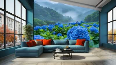 A sea of blue hydrangeas and purple and green flowers in the mountains of Japan with misty rain on them, shot with a Sony Alpha A7 III camera using long exposure, capturing beautiful scenery in high Wall mural