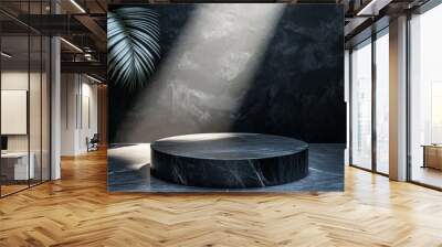 A modern, round marble pedestal illuminated by soft light, set against a dark textured wall and a lush green plant, creating a serene ambiance. Wall mural