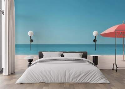 A serene beach scene featuring a red umbrella on pristine white sand under a clear blue sky. Wall mural