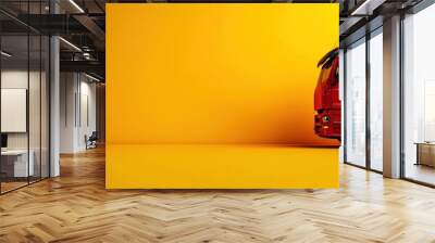 A vibrant red truck against a bright yellow background, showcasing modern transportation and logistics design. Wall mural