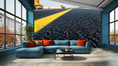 Close-up of a freshly paved asphalt road with a yellow line. Wall mural