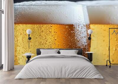 Golden beer glasses arranged in a row with condensation on a black background. Wall mural