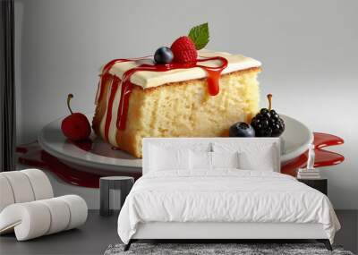 Butter cake, dollop of cream on top with red drizzle, a leaf, fruit slices round cake isolated on a white background . Wall mural