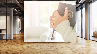 woman hands praying to god with the bible. Wall mural